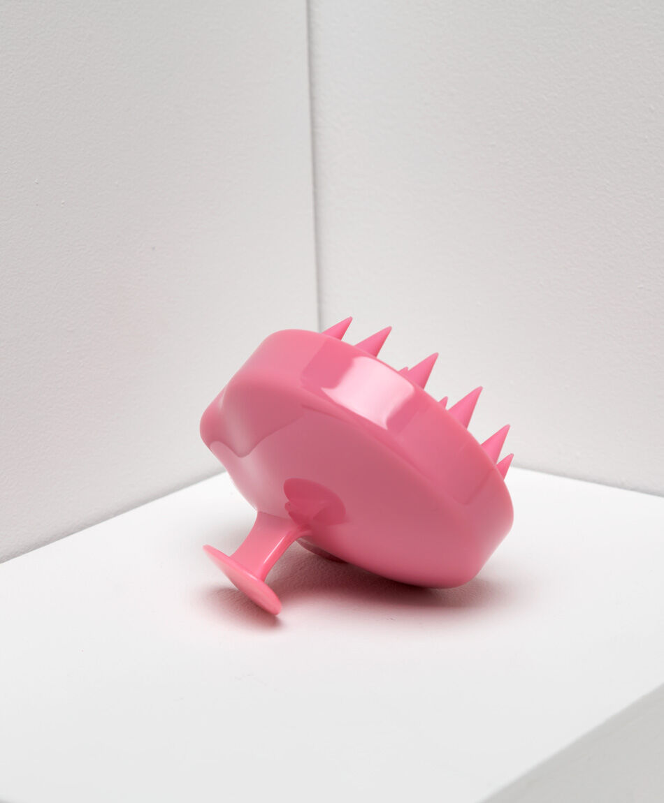 Masajeador capilar rosado