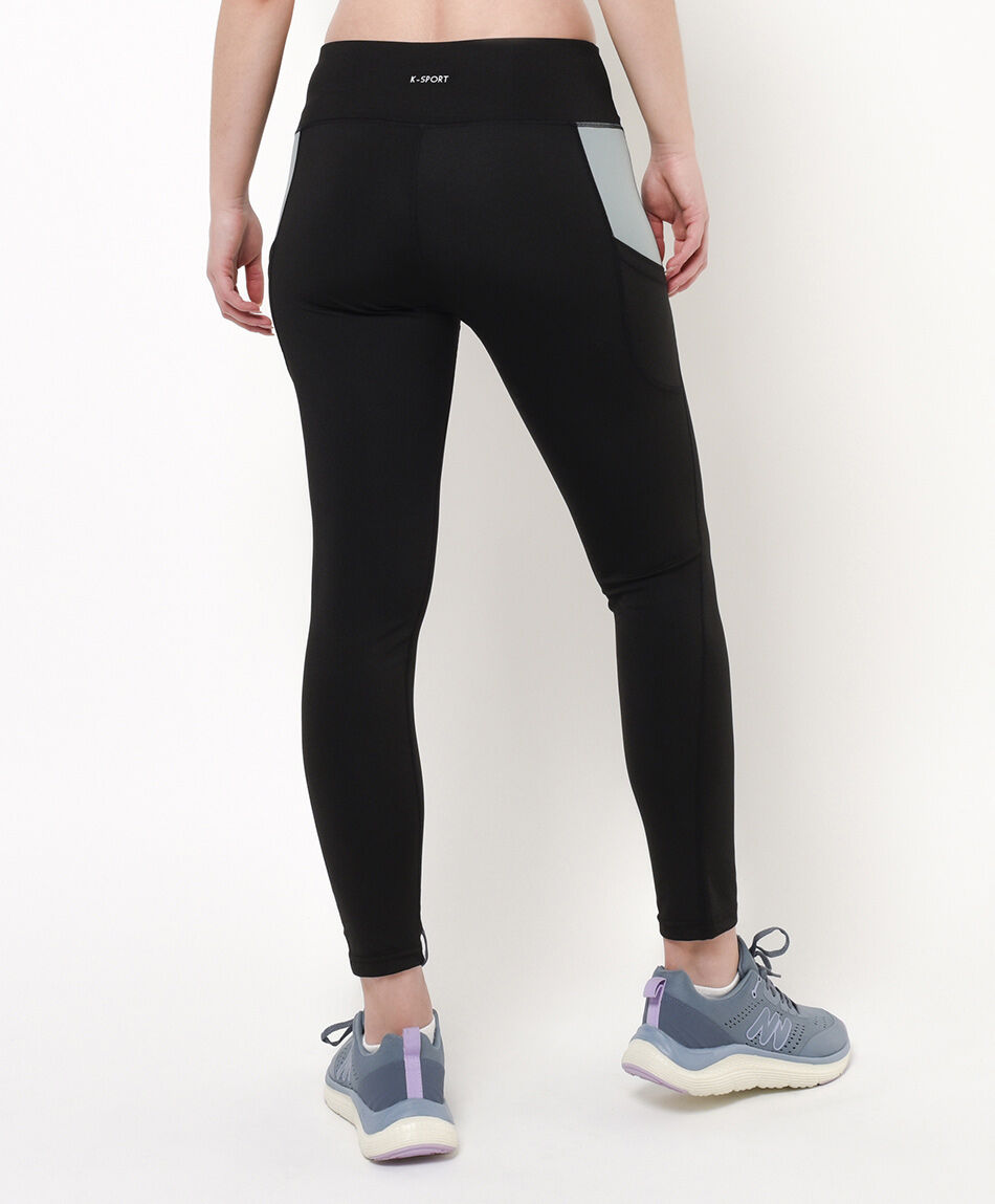 Calza deportiva mujer con bolsillo color