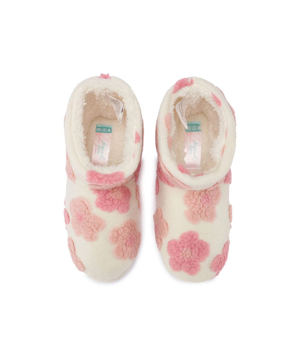 Bot&iacute;n descanso mujer flores relieves